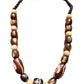 Single layer round and geometric beaded necklace